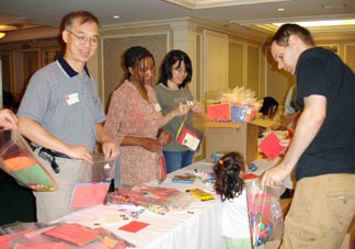 Cornell alumni, their family members and friends assemble care packages