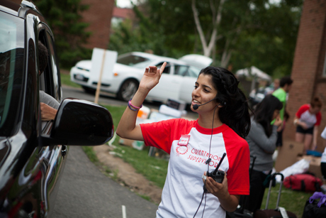 volunteer directs traffic