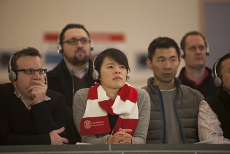 passersby watching Shark Tank presentations
