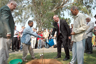 Cornell President David Skorton participates in a tree planting