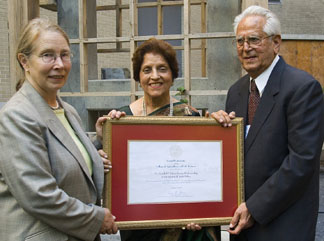 presents Nandlal P. Tolani, right, and Papu Tolani with a certificate to honor 