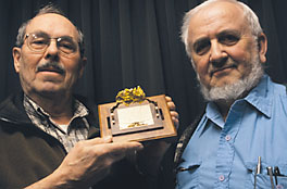 Professors hold gold specimen