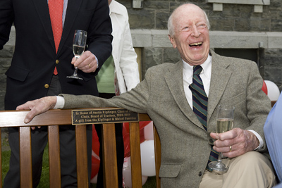 Austin Kiplinger sits on the bench named for him