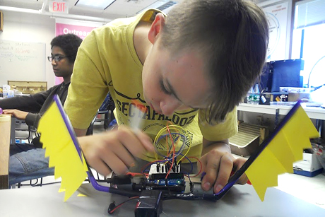 student adds colorful wings