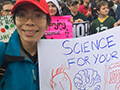 student holds sign
