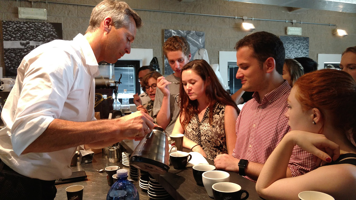 Students taste coffee in Turin