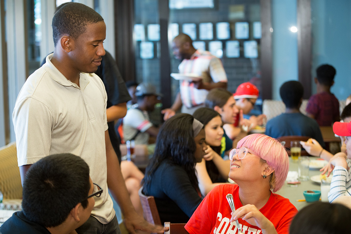 Matthew Knight '19, standing, talks with Christopher Talavera and Betty Wang