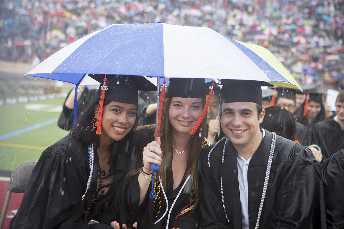 Trio under umbrella