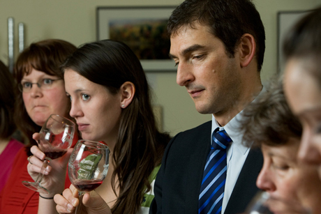 people tasting wine
