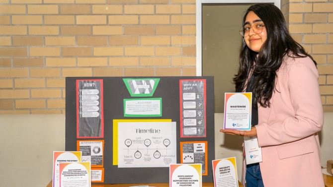 Minal Iftikar, a first-year student at Stony Brook, with a display of her contribution, Wastewise, an AI-powered app that scan’s a user’s leftover food waste and gives suggestions on how to re-use that waste.
