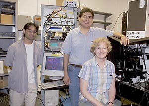 Posing in the Cornell DRBIO (Developmental Resource for Biophysical Imaging and Opto-electronics) laboratory where scans of living brain cells confirmed the astrocyte-neuron lactate shuttle theory are, from left, Harshad D. Vishwasrao, Karl A. Kasischke and Patricia J. Fisher
