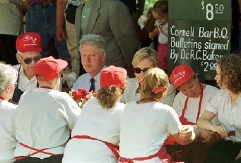 Bob Baker introduces the Clintons to chicken with his special Cornell barbecue sauc
