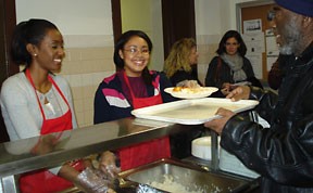 Omobola Babarinsa '10 and Michelle Chi '10 serve food