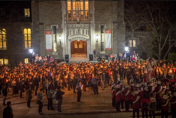 Hundreds of students gather for a candlelight 