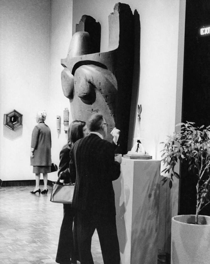 Visitors view Norman Daly’s “Fragments of Effigy of Holmeek” at the Indianapolis Museum of Art in 1973.