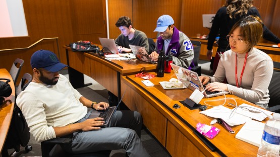 Students work on presentations during Cornell’s inaugural Legal Information Institute Hackathon in Myron Taylor Hall.