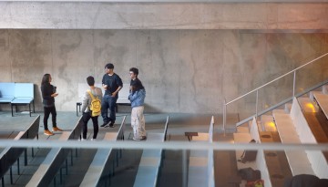 Students gather in Milstein Hall after a lecture concludes.
