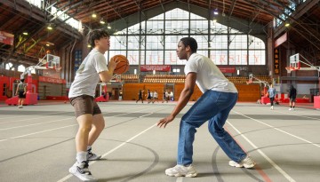 Students play basketball in Barton Hall.