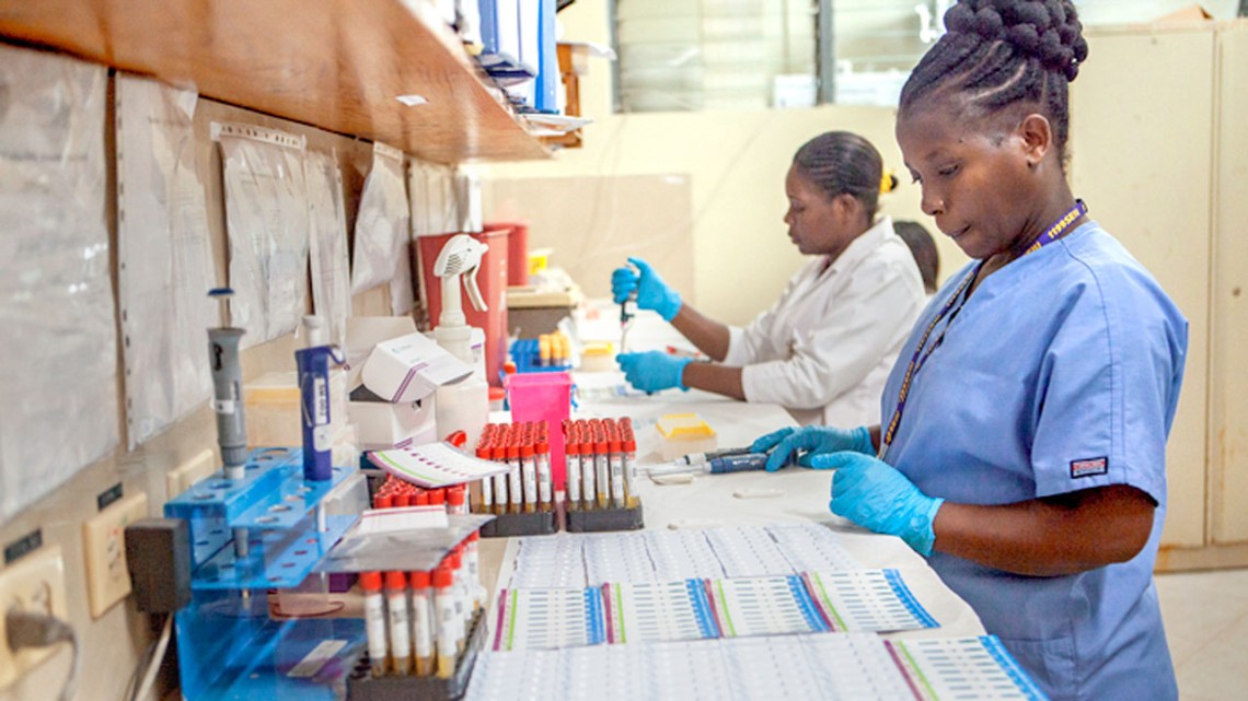 Staff at GHESKIO clinic in Port-au-Prince, Haiti, process laboratory samples