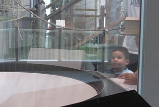 Luis Fernando checks out a model of the telescope