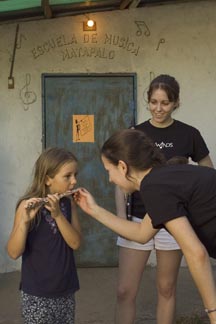 Christine Marschilok '08 helps a Matapalo music student