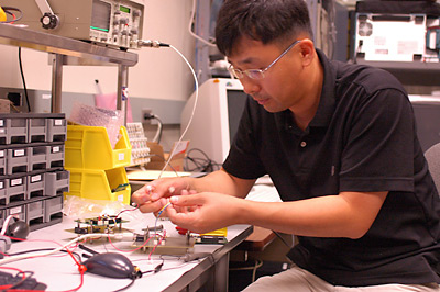 Jin-Woo Lee tests CubeSat electronic