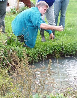 Larry Geohring taking samples of water
