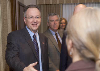 Skorton shakes hands