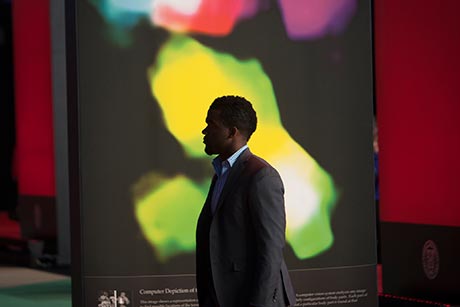 man's silhouette against screen at Barton