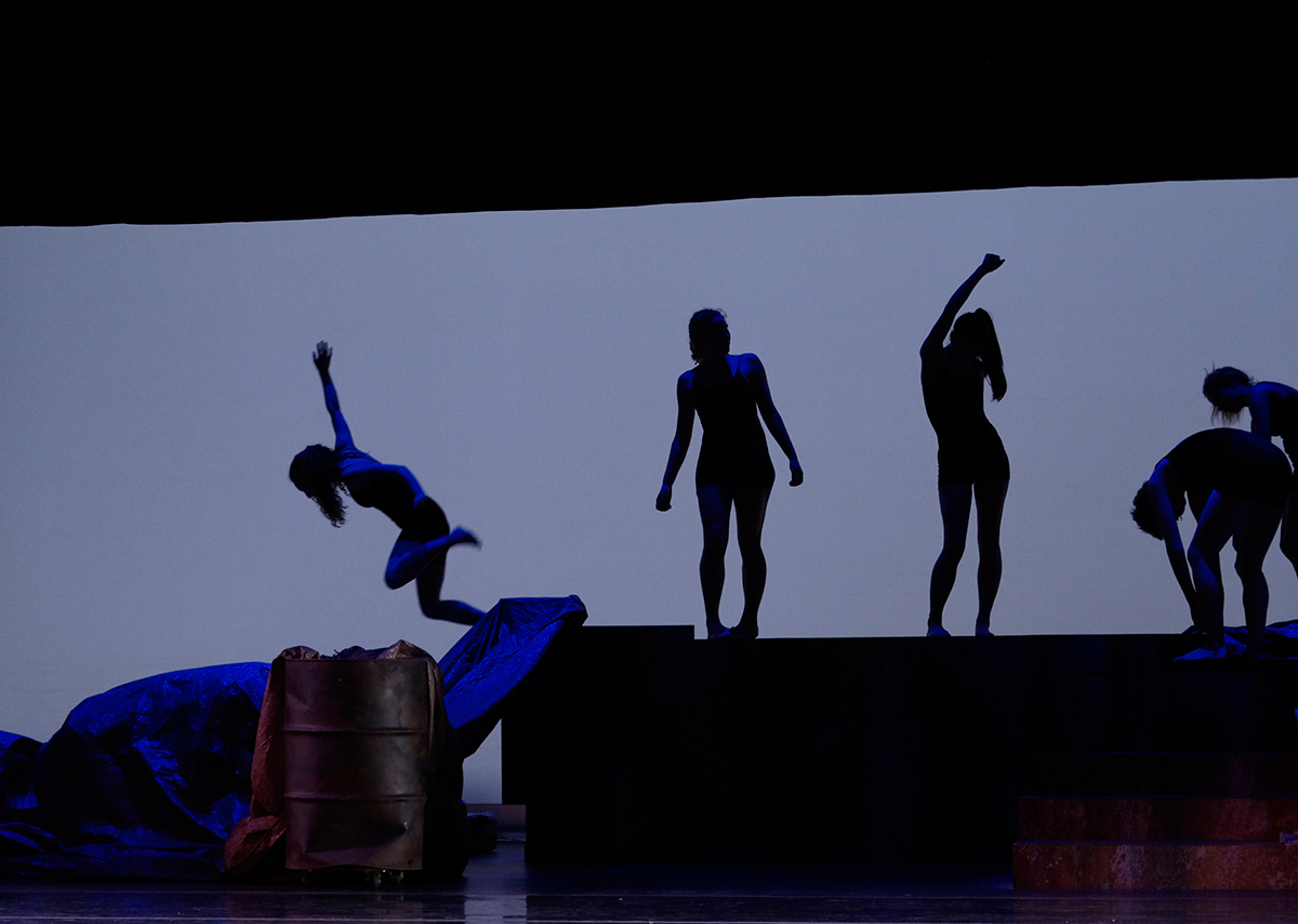 students dancing in silhouette