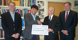 Lang Tong receiving award from Lockheed Martin